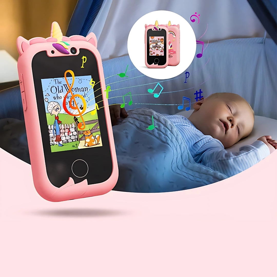 Kids learning phone in pink unicorn design, displaying a storybook image with musical notes, next to a sleeping baby.