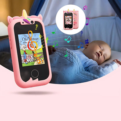 Kids learning phone in pink unicorn design, displaying a storybook image with musical notes, next to a sleeping baby.